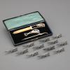 12 knife rests and writing set, around 1920