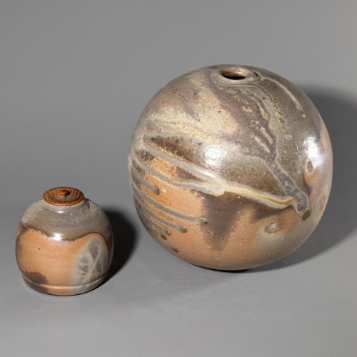 A spherical vase and a small lidded vessel